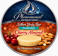 Phenomenal Skinsations Cherry Almond travel size Silken Body Bar label showing a round moisture bar beside fresh cherries and almonds on a wooden surface